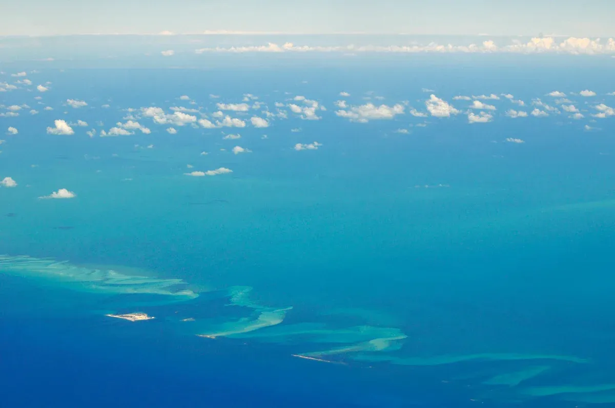 Aerial view of cays and shoals south of Bimini, the water crossed on a Bahamas day trip from Miami