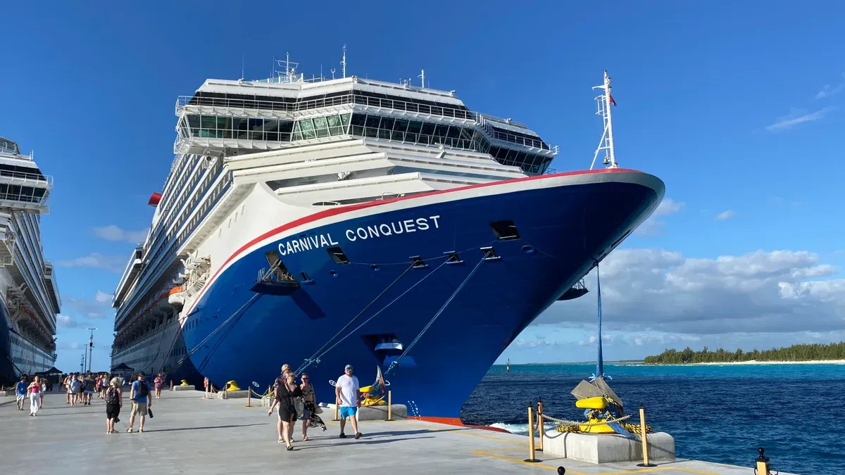 Carnival Conquest docked at Celebration Key on Grand Bahama, a stop on a 3 day Bahamas cruise from Miami