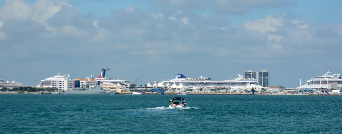 Row of cruise ships along the Port of Miami cruise terminal seen from the water
