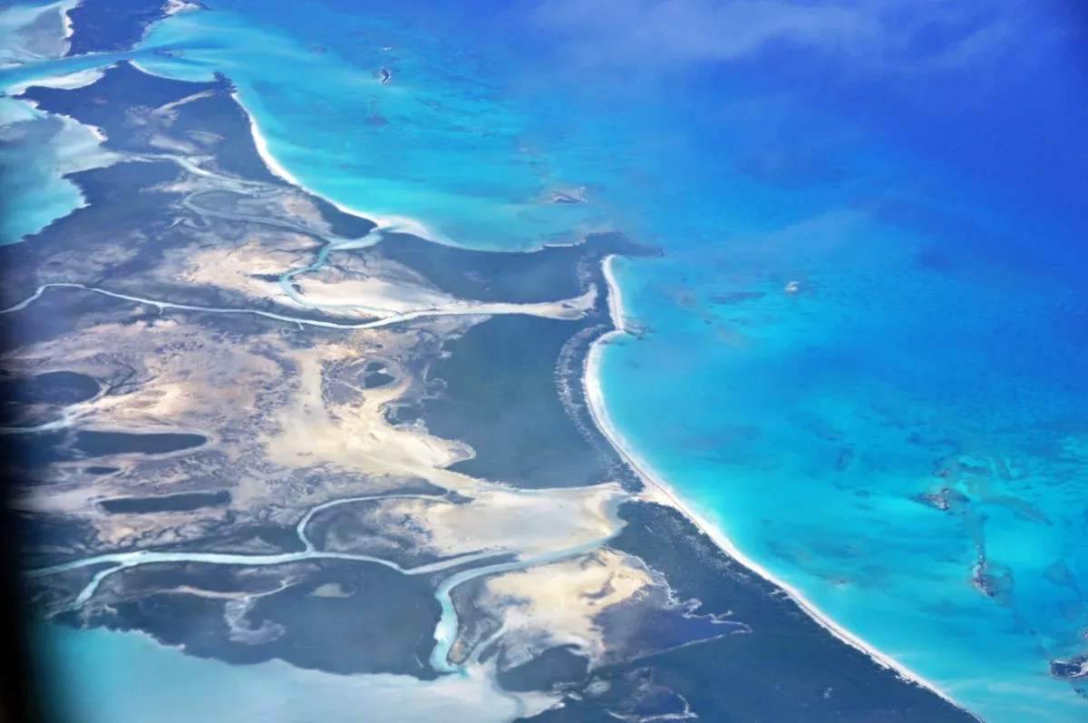 Aerial view of Exuma cays and turquoise channels reached by an Exuma powerboat day trip from Nassau